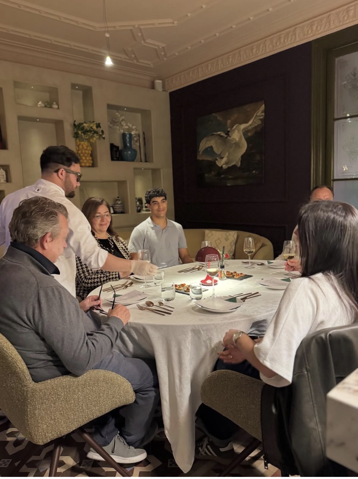 Guests gathered around the Temenos table